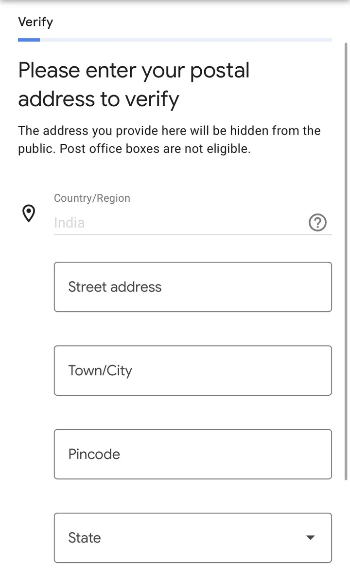 Verification screen asking for a postal address, noting it will be hidden from the public and that post office boxes are not eligible